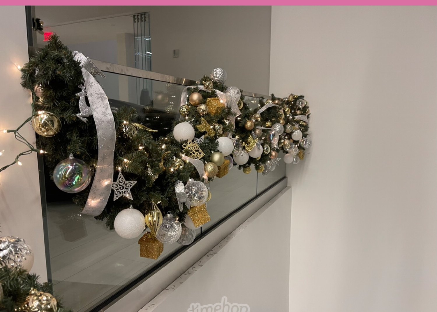 Garland and ornaments on a glass railing